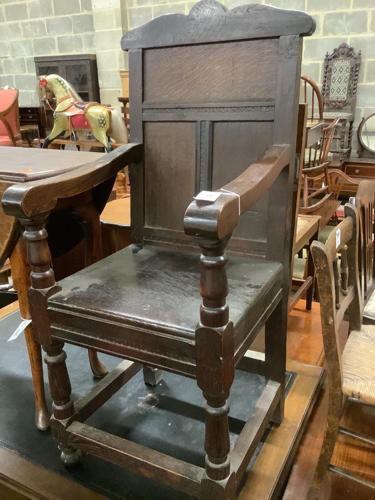 A 17th century style oak wainscot chair, width 48cm, depth 50cm, height 110cm